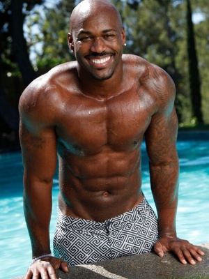 Personal trainer Dolvett Quince is sleeveless showing his biceps. (